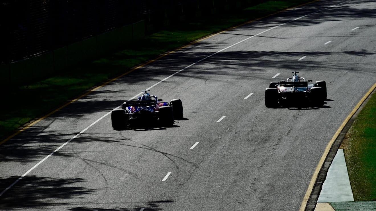Brendon Hartley (NZL) Scuderia Toro Rosso STR13 and Romain Grosjean (FRA) Haas VF-18 at Formula One World Championship, Rd1, Australian Grand Prix, Race, Melbourne, Australia, Sunday 25 March 2018. © Jerry Andre/Sutton Images
