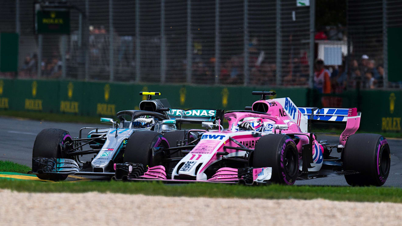 Valtteri Bottas (FIN) Mercedes-AMG F1 W09 EQ Power+ and Sergio Perez (MEX) Force India battle at Formula One World Championship, Rd1, Australian Grand Prix, Race, Melbourne, Australia, Sunday 25 March 2018. © Daniel Kalisz/Sutton Images