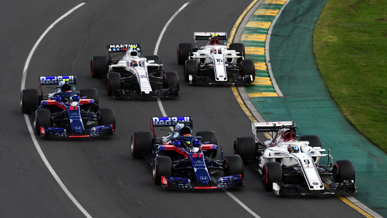 Marcus Ericsson (SWE) Alfa Romeo Sauber C37 and Brendon Hartley (NZL) Scuderia Toro Rosso STR13 battle at Formula One World Championship, Rd1, Australian Grand Prix, Race, Melbourne, Australia, Sunday 25 March 2018. © Mark Sutton/Sutton Images