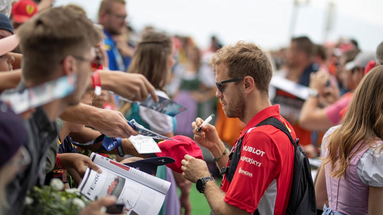 Sebastian Vettel (GER) Ferrari signs autographs for the fans at Formula One World Championship, Rd9, Austrian Grand Prix, Qualifying, Spielberg, Austria, Saturday 30 June 2018. © Manuel Goria/Sutton Images