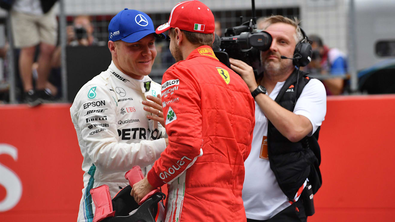 Pole sitter Valtteri Bottas (FIN) Mercedes-AMG F1 and Sebastian Vettel (GER) Ferrari celebrate in parc ferme at Formula One World Championship, Rd9, Austrian Grand Prix, Qualifying, Spielberg, Austria, Saturday 30 June 2018. © Jerry Andre/Sutton Images