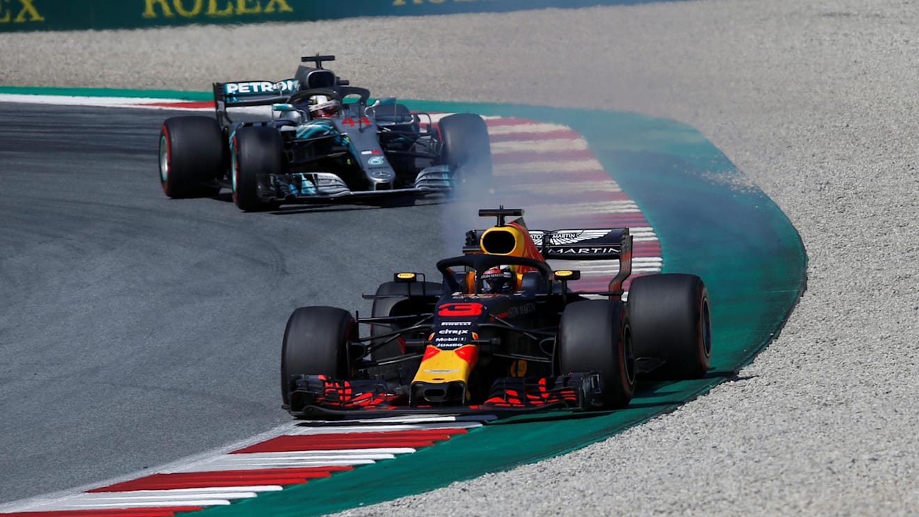 Daniel Ricciardo (AUS) Red Bull Racing RB14 with smoking engine leads Lewis Hamilton (GBR) Mercedes-AMG F1 W09 EQ Power+ at Formula One World Championship, Rd9, Austrian Grand Prix, Race, Spielberg, Austria, Sunday 1 July 2018. © Manuel Goria/Sutton Images