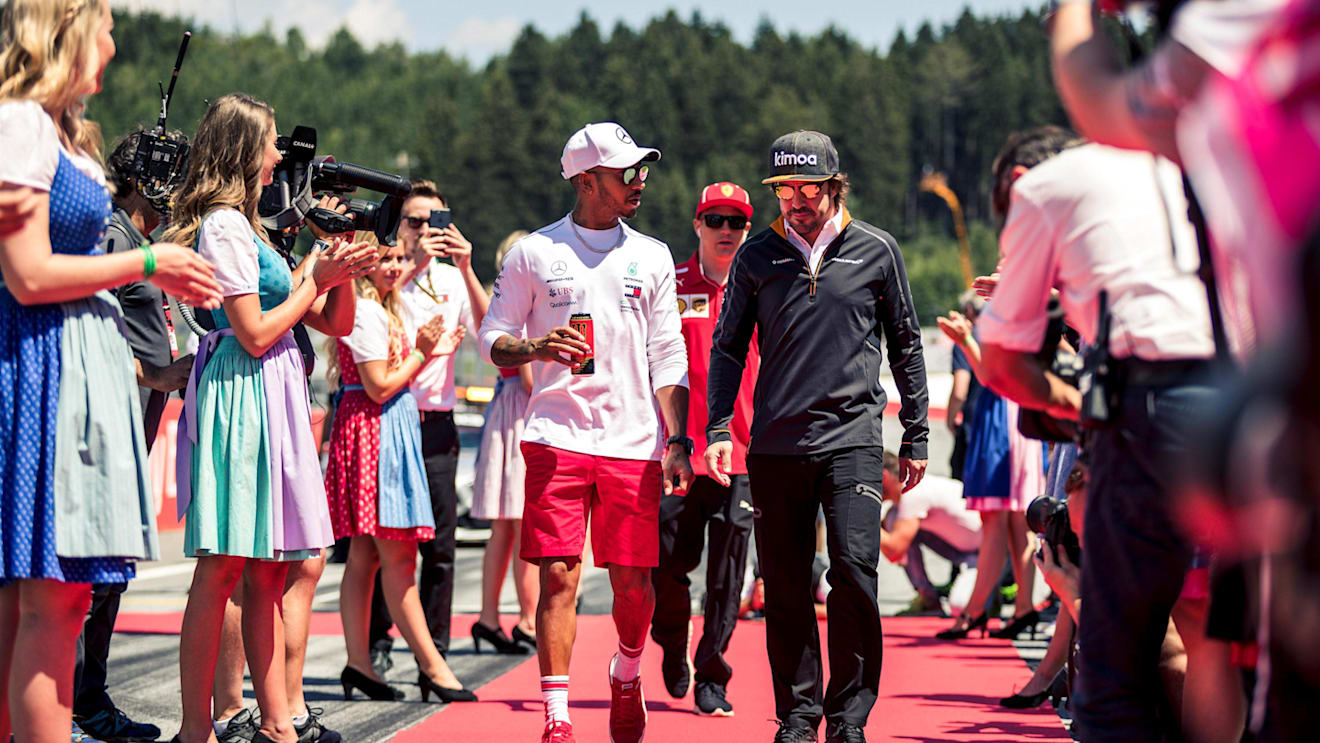 Lewis Hamilton (GBR) Mercedes-AMG F1 and Fernando Alonso (ESP) McLaren on the drivers parade at Formula One World Championship, Rd9, Austrian Grand Prix, Race, Spielberg, Austria, Sunday 1 July 2018. © Manuel Goria/Sutton Images