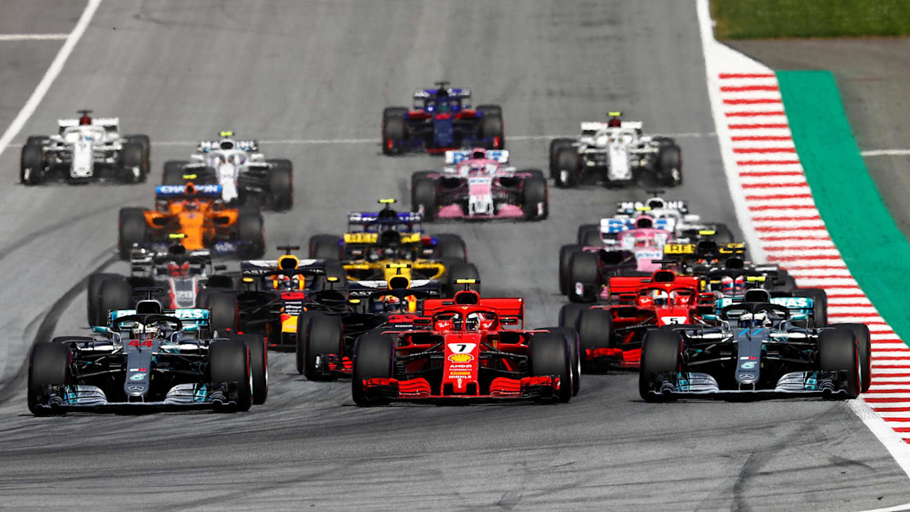 Lewis Hamilton (GBR) Mercedes-AMG F1 W09 EQ Power+, Kimi Raikkonen (FIN) Ferrari SF-71H and Valtteri Bottas (FIN) Mercedes-AMG F1 W09 EQ Power+ at the start of the race at Formula One World Championship, Rd9, Austrian Grand Prix, Race, Spielberg, Austria, Sunday 1 July 2018. © Glenn Dunbar/LAT/Sutton Images