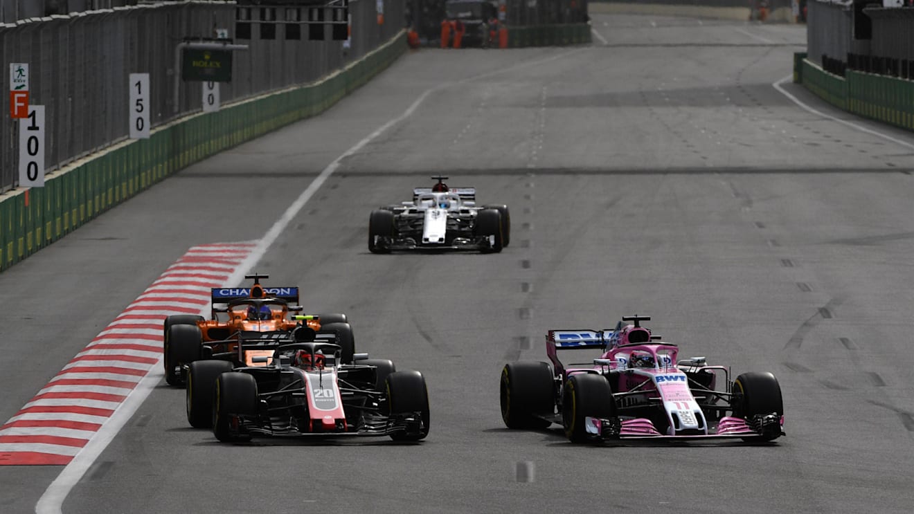 Kevin Magnussen (DEN) Haas VF-18 and Sergio Perez (MEX) Force India VJM11 battle at Formula One World Championship, Rd4, Azerbaijan Grand Prix, Race, Baku City Circuit, Baku, Azerbaijan, Sunday 29 April 2018. © Mark Sutton/Sutton Images