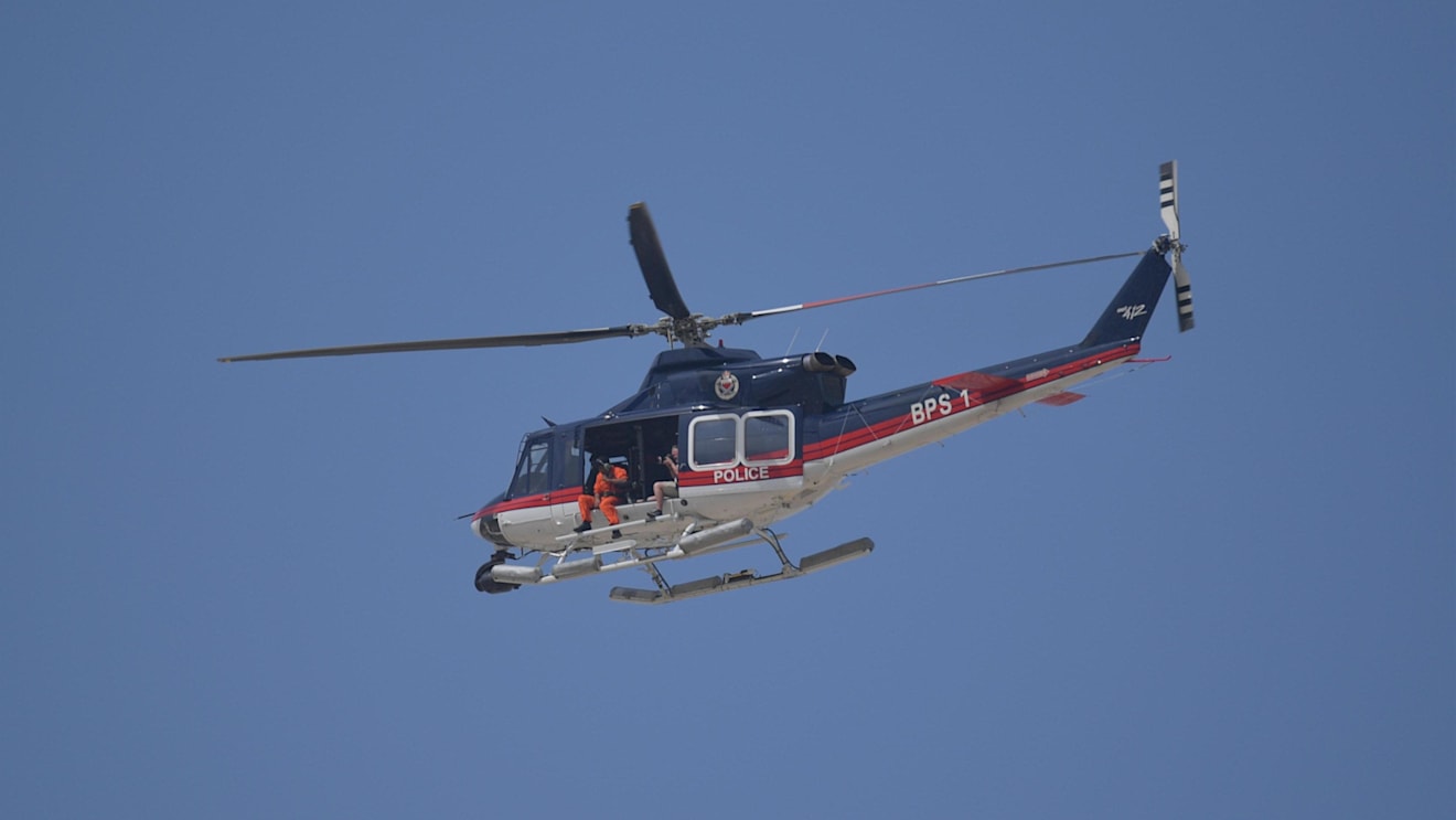 Mark Sutton (GBR) Sutton Images F1 Photographer shoots form the helicopter at Formula One World Championship, Rd2, Bahrain Grand Prix, Qualifying, Bahrain International Circuit, Sakhir, Bahrain, Saturday 7 April 2018. © Simon Galloway/Sutton Images