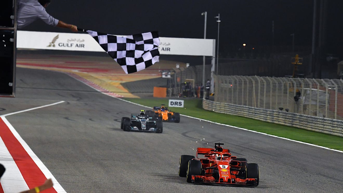 Race winner Sebastian Vettel (GER) Ferrari SF-71H crosses the line and takes the chequered flag at Formula One World Championship, Rd2, Bahrain Grand Prix, Race, Bahrain International Circuit, Sakhir, Bahrain, Sunday 8 April 2018. © Mark Sutton/Sutton Images
