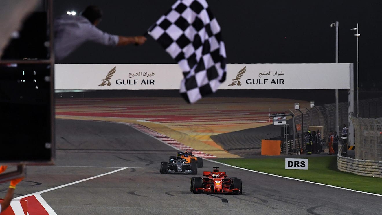 Race winner Sebastian Vettel (GER) Ferrari SF-71H crosses the line and takes the chequered flag at Formula One World Championship, Rd2, Bahrain Grand Prix, Race, Bahrain International Circuit, Sakhir, Bahrain, Sunday 8 April 2018.©Mark Sutton/Sutton Images