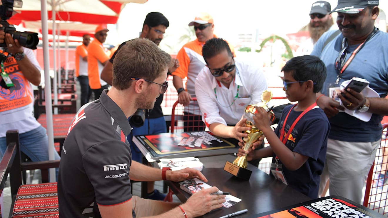 Romain Grosjean (FRA) Haas F1 signs autographs for the fans at Formula One World Championship, Rd2, Bahrain Grand Prix, Race, Bahrain International Circuit, Sakhir, Bahrain, Sunday 8 April 2018. © Simon Galloway/Sutton Images
