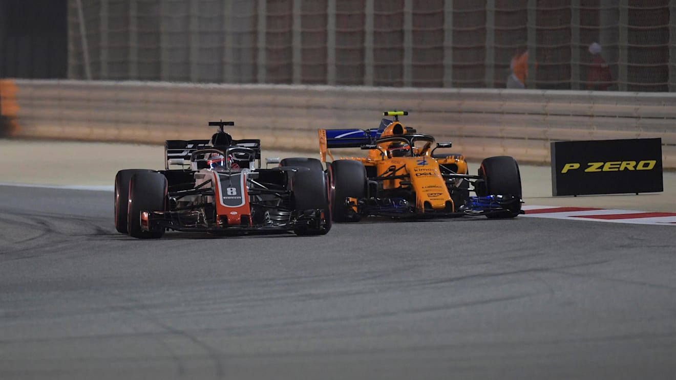 Romain Grosjean (FRA) Haas VF-18 and Stoffel Vandoorne (BEL) McLaren MCL33 battle at Formula One World Championship, Rd2, Bahrain Grand Prix, Race, Bahrain International Circuit, Sakhir, Bahrain, Sunday 8 April 2018. © Simon Galloway/Sutton Images