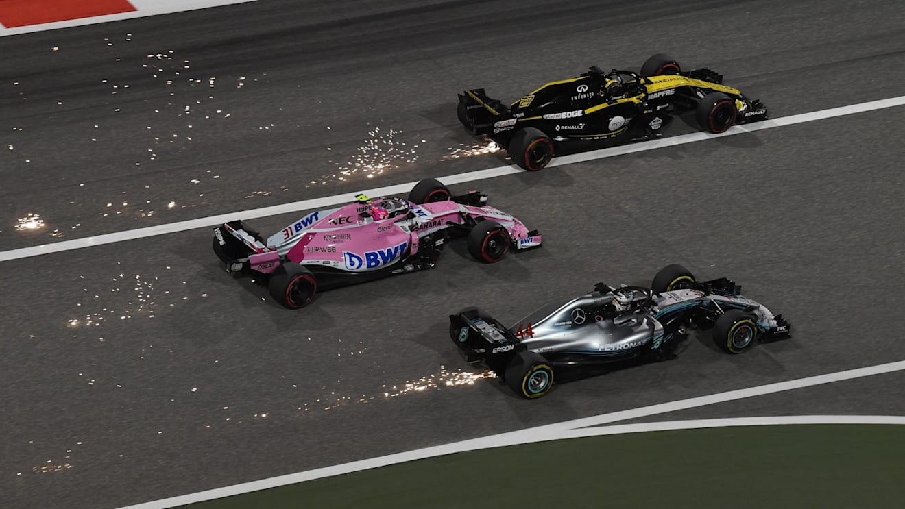 Lewis Hamilton (GBR) Mercedes-AMG F1 W09 EQ Power+, Esteban Ocon (FRA) Force India VJM11 and Nico Hulkenberg (GER) Renault Sport F1 Team RS18 battle at Formula One World Championship, Rd2, Bahrain Grand Prix, Race, Bahrain International Circuit, Sakhir, Bahrain, Sunday 8 April 2018. © Mark Sutton/Sutton Images