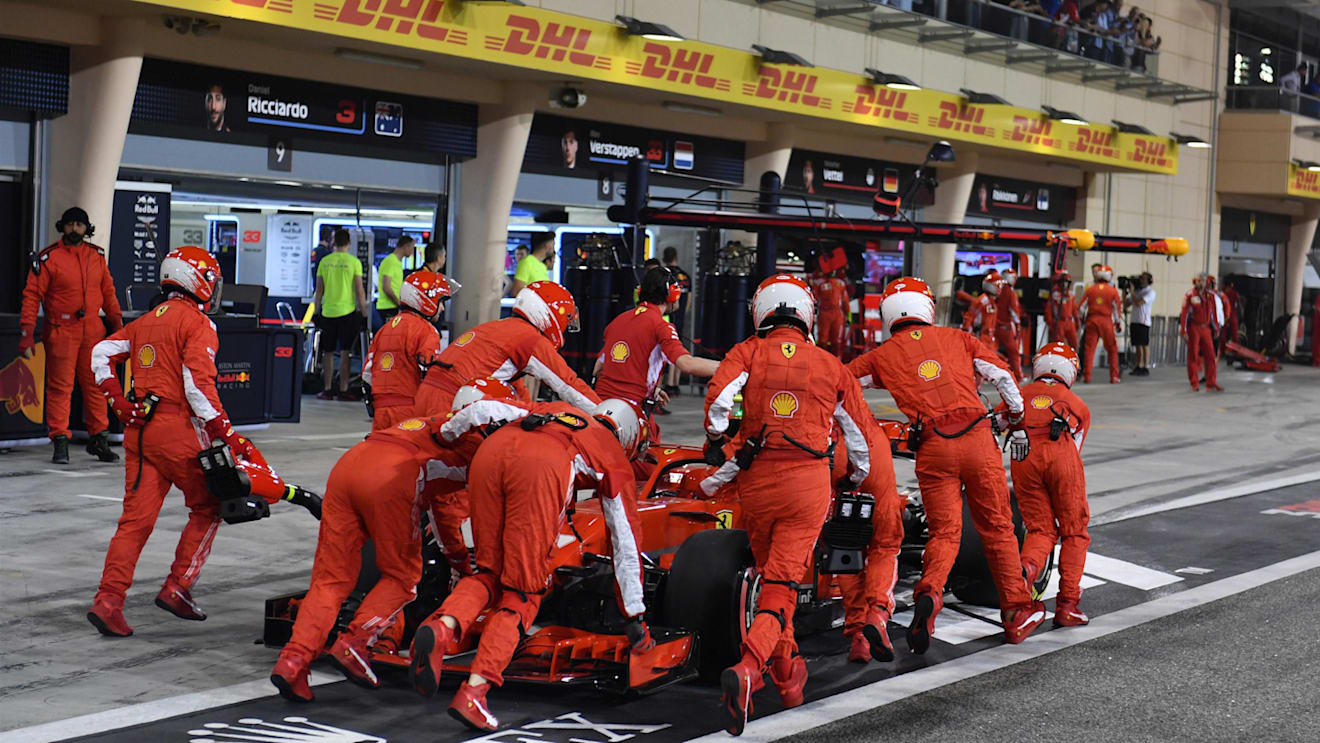 The car of Kimi Raikkonen (FIN) Ferrari SF-71H is pushed back in pit lane at Formula One World Championship, Rd2, Bahrain Grand Prix, Race, Bahrain International Circuit, Sakhir, Bahrain, Sunday 8 April 2018. © Mark Sutton/Sutton Images