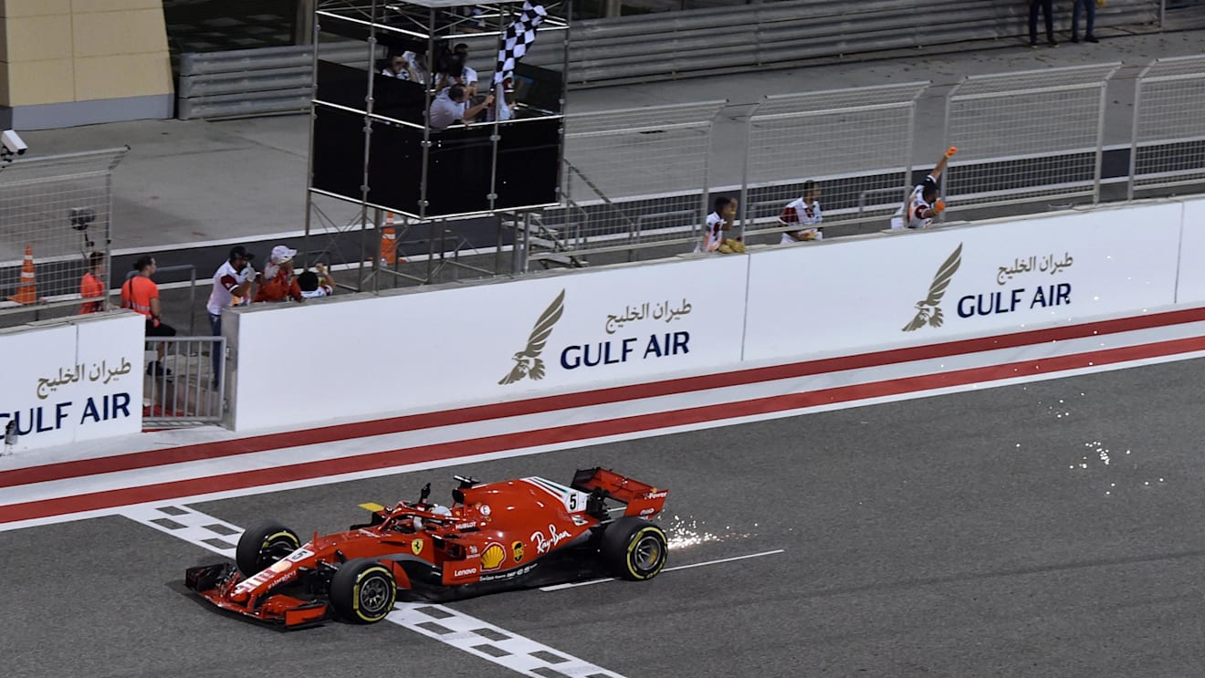 Race winner Sebastian Vettel (GER) Ferrari SF-71H crosses the line and takes the chequered flag at Formula One World Championship, Rd2, Bahrain Grand Prix, Race, Bahrain International Circuit, Sakhir, Bahrain, Sunday 8 April 2018. © Simon Galloway/Sutton Images