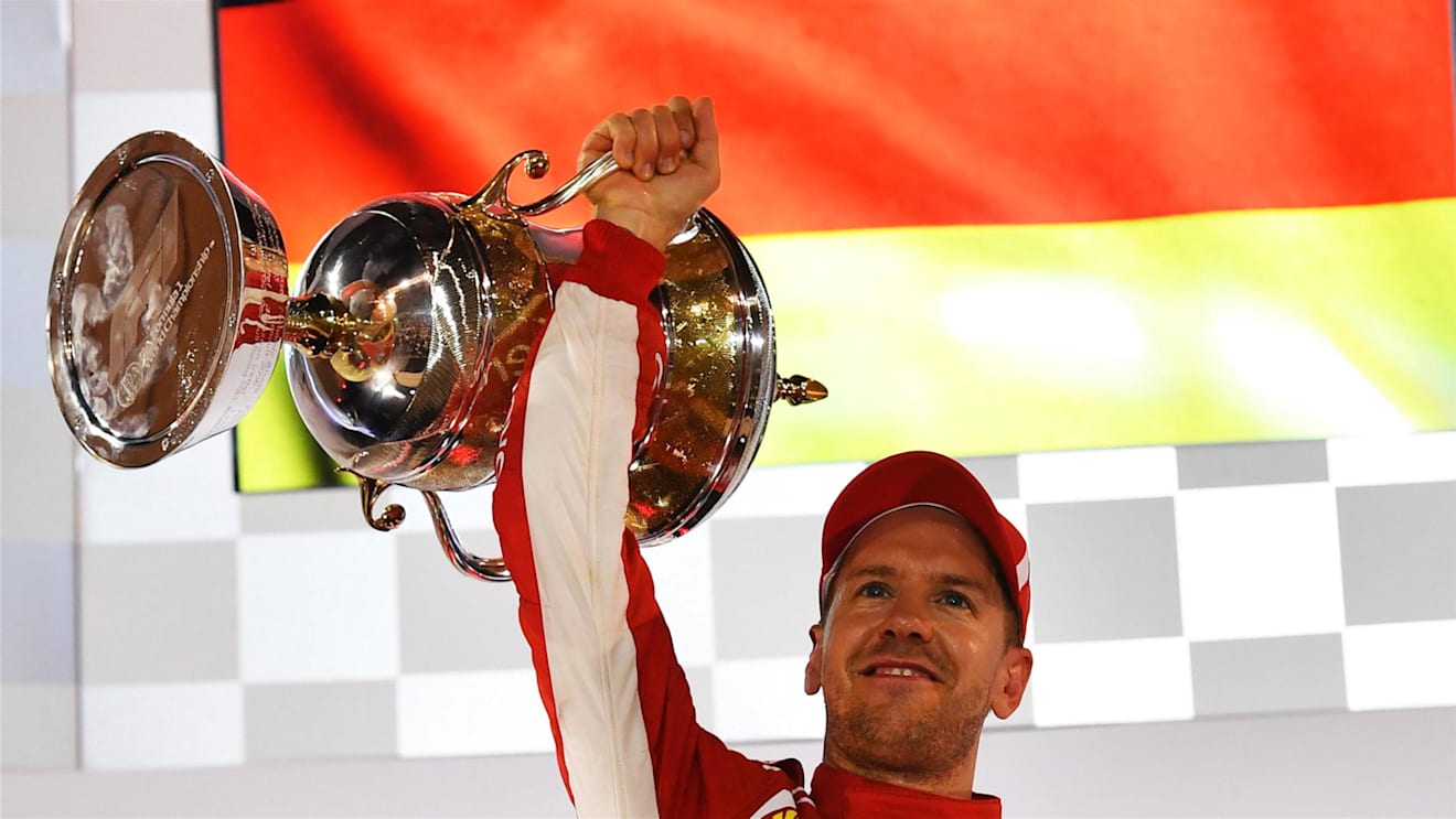 Race winner Sebastian Vettel (GER) Ferrari celebrates on the podium at Formula One World Championship, Rd2, Bahrain Grand Prix, Race, Bahrain International Circuit, Sakhir, Bahrain, Sunday 8 April 2018. © Jerry Andre/Sutton Images