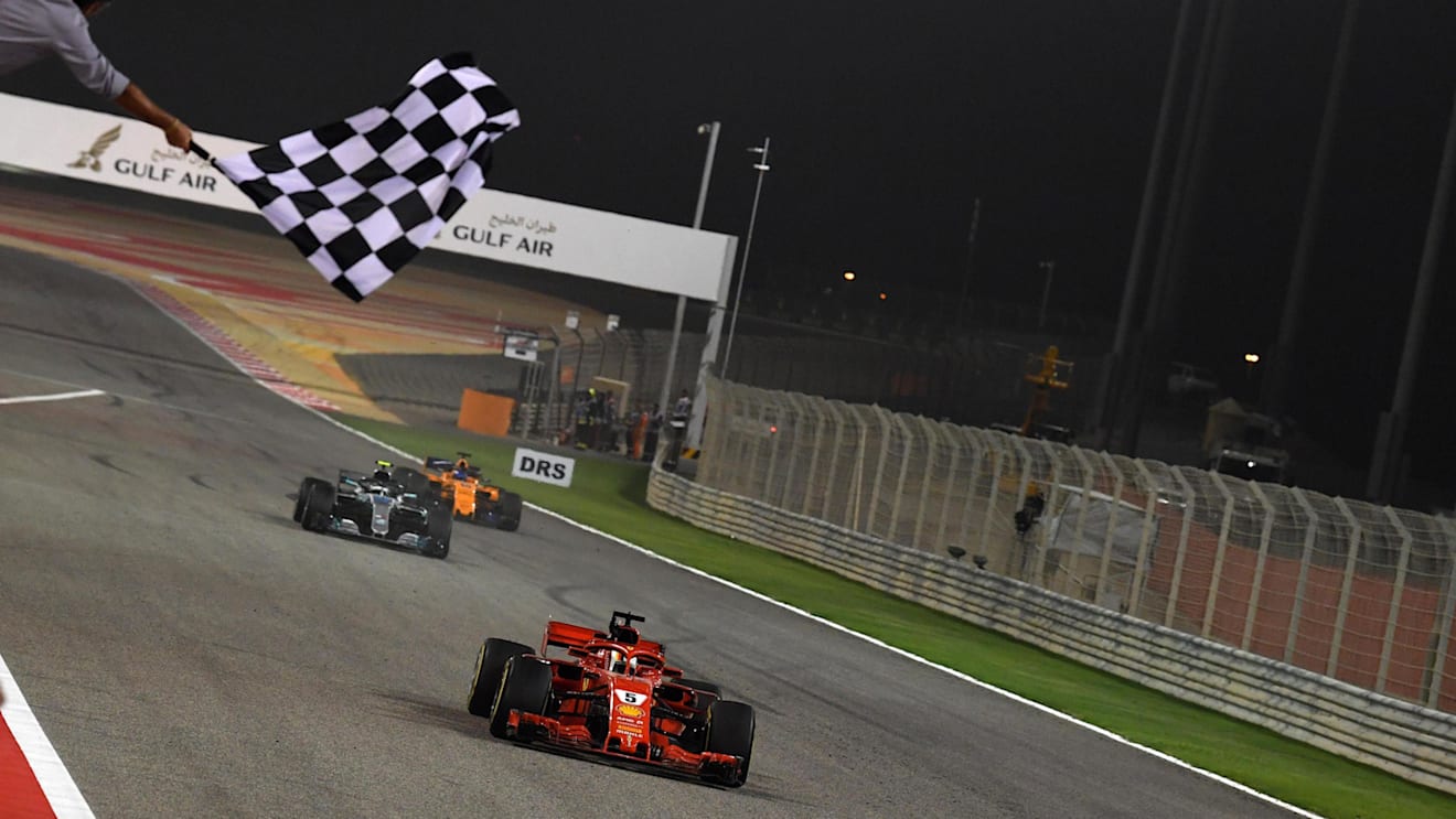 Race winner Sebastian Vettel (GER) Ferrari SF-71H crosses the line and takes the chequered flag at Formula One World Championship, Rd2, Bahrain Grand Prix, Race, Bahrain International Circuit, Sakhir, Bahrain, Sunday 8 April 2018. © Mark Sutton/Sutton Images