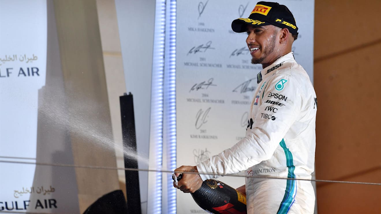 Lewis Hamilton (GBR) Mercedes-AMGlhp celebrates on the podium at Formula One World Championship, Rd2, Bahrain Grand Prix, Race, Bahrain International Circuit, Sakhir, Bahrain, Sunday 8 April 2018. © Jerry Andre/Sutton Images