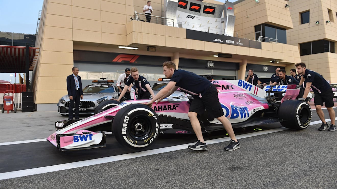 Force India F1 mechanics with Force India VJM11 in pit lane at Formula One World Championship, Rd2, Bahrain Grand Prix, Preparations, Bahrain International Circuit, Sakhir, Bahrain, Thursday 5 April 2018. © Simon Galloway/Sutton Images