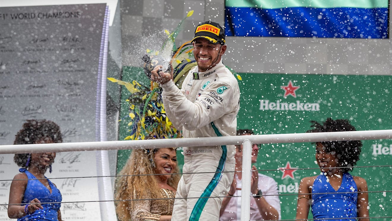 Race winner Lewis Hamilton, Mercedes AMG F1 celebrates on the podium with the champagne at Formula One World Championship, Rd20, Brazilian Grand Prix, Race, Interlagos, Sao Paulo, Brazil, Sunday 11 November 2018.