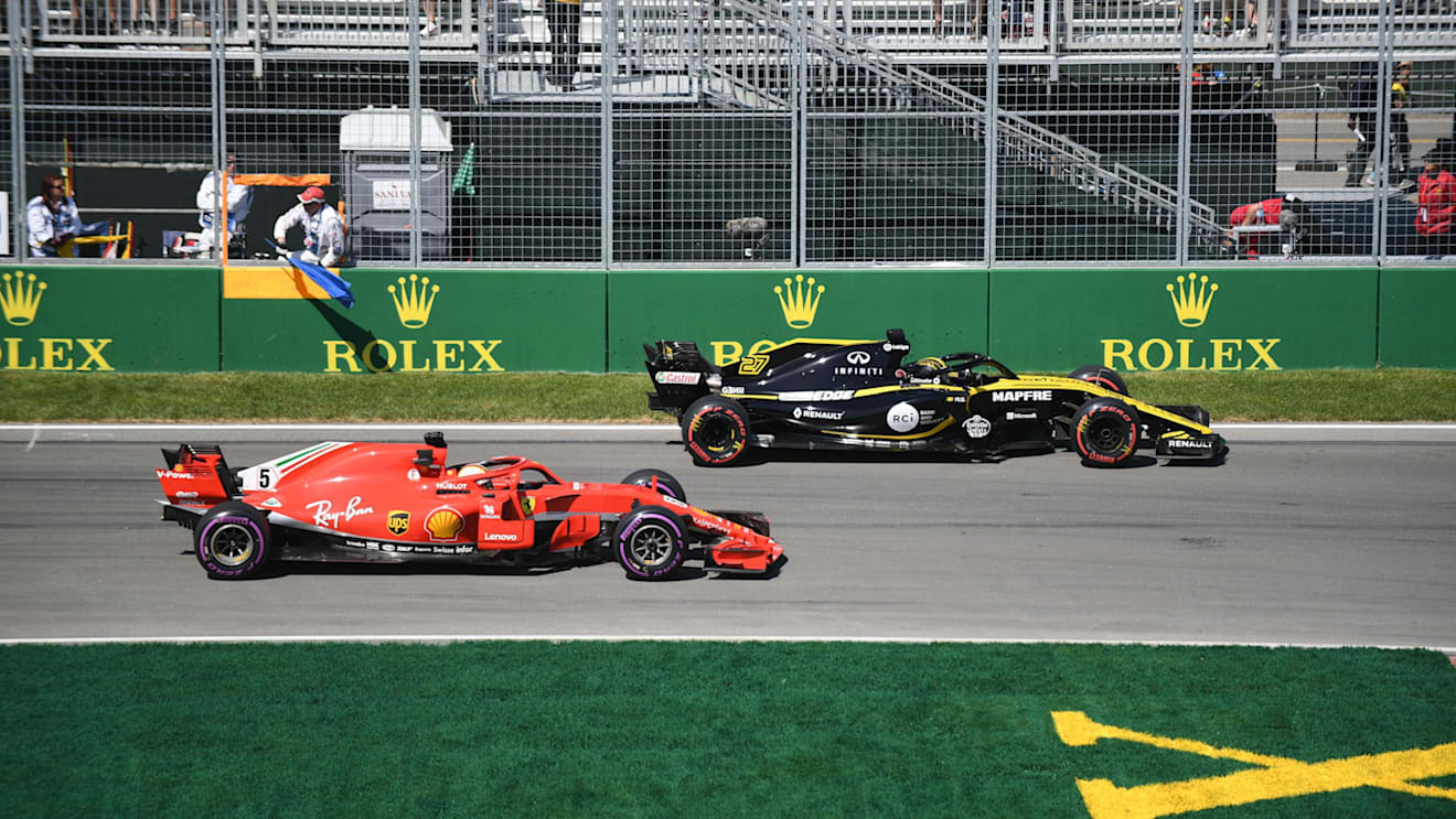 Nico Hulkenberg (GER) Renault Sport F1 Team RS18 and Sebastian Vettel (GER) Ferrari SF-71H at Formula One World Championship, Rd7, Canadian Grand Prix, Practice, Montreal, Canada, Friday 8 June 2018. © Simon Galloway/Sutton Images