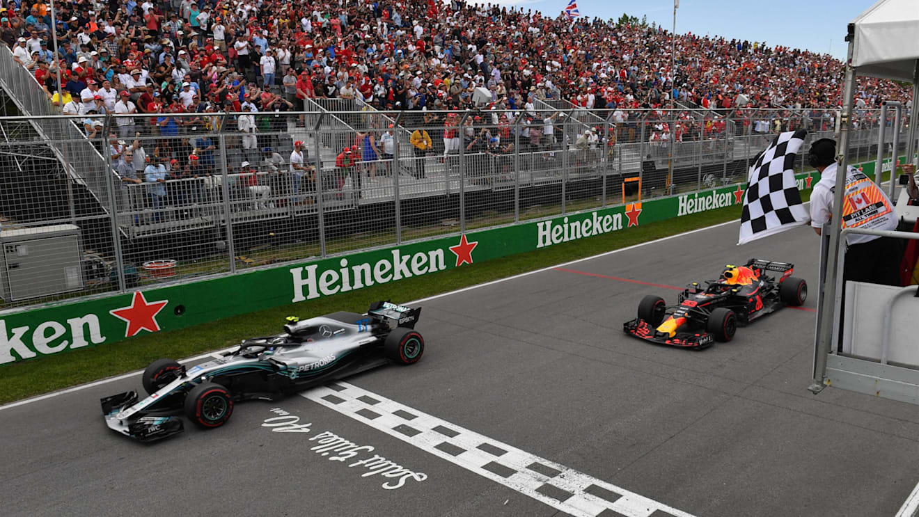 Valtteri Bottas (FIN) Mercedes-AMG F1 W09 EQ Power+ and Max Verstappen (NED) Red Bull Racing RB14 take the chequered flag at Formula One World Championship, Rd7, Canadian Grand Prix, Race, Montreal, Canada, Sunday10 June 2018. © Mark Sutton/Sutton Images
