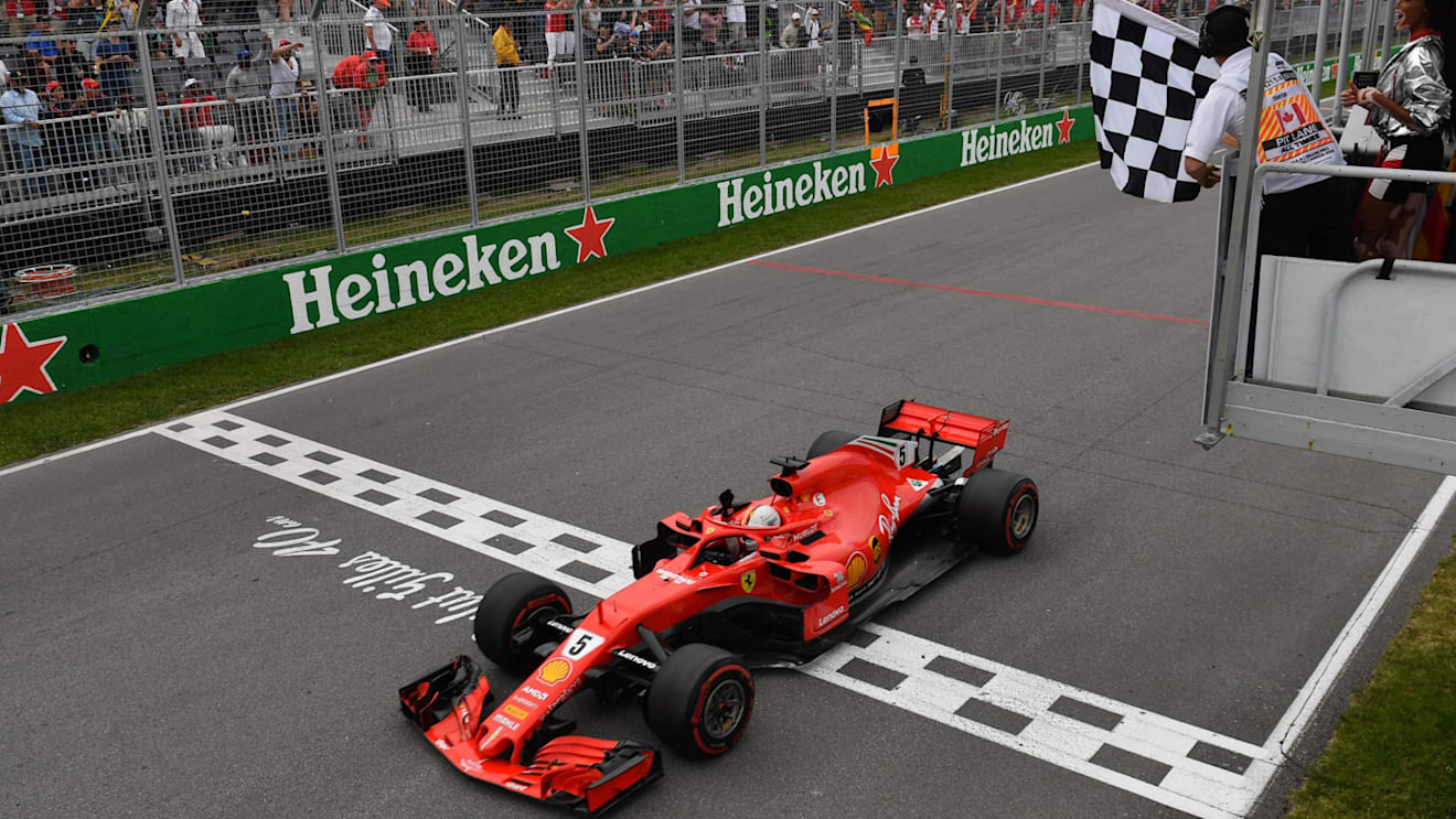 Race winner Sebastian Vettel (GER) Ferrari SF-71H takes the chequered flag at Formula One World Championship, Rd7, Canadian Grand Prix, Race, Montreal, Canada, Sunday10 June 2018. © Mark Sutton/Sutton Images