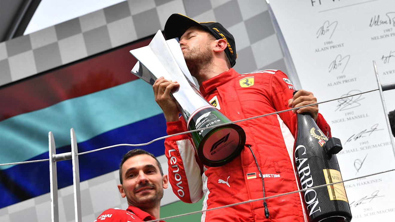 Race winner Sebastian Vettel (GER) Ferrari SF-71H celebrates on the podium and kisses the trophy at Formula One World Championship, Rd7, Canadian Grand Prix, Race, Montreal, Canada, Sunday10 June 2018. © Jerry Andre/Sutton Images