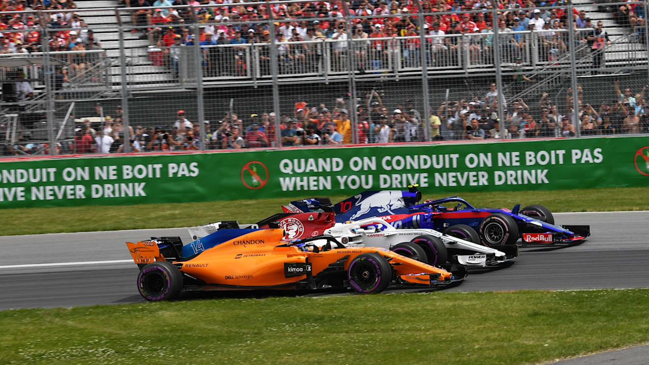 Fernando Alonso (ESP) McLaren MCL33, Marcus Ericsson (SWE) Alfa Romeo Sauber C37 and Pierre Gasly (FRA) Scuderia Toro Rosso STR13 at the start of the race at Formula One World Championship, Rd7, Canadian Grand Prix, Race, Montreal, Canada, Sunday10 June 2018. © Jerry Andre/Sutton Images