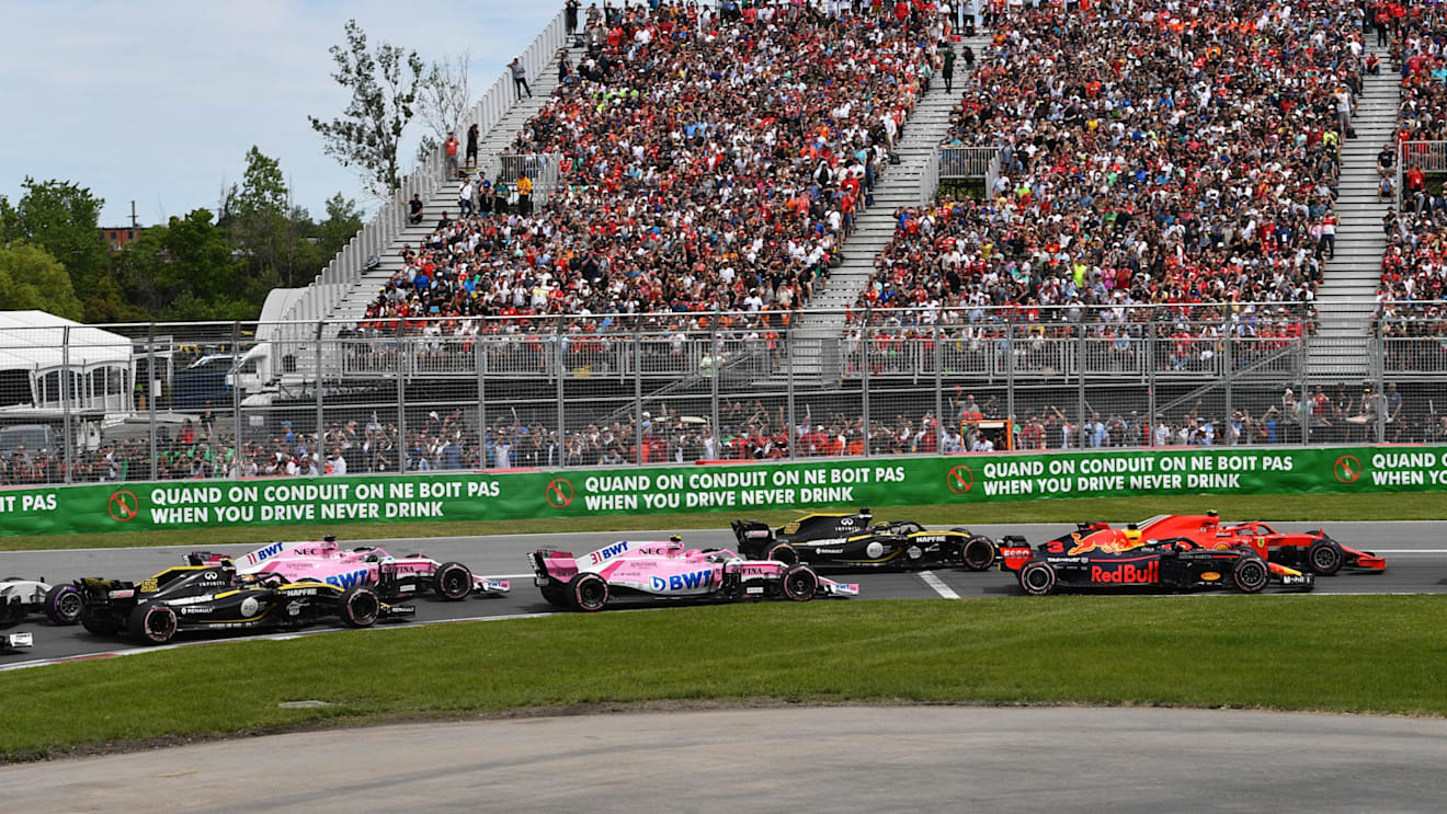 Daniel Ricciardo (AUS) Red Bull Racing RB14 and Kimi Raikkonen (FIN) Ferrari SF-71H battle at the start of the race at Formula One World Championship, Rd7, Canadian Grand Prix, Race, Montreal, Canada, Sunday10 June 2018. © Jerry Andre/Sutton Images
