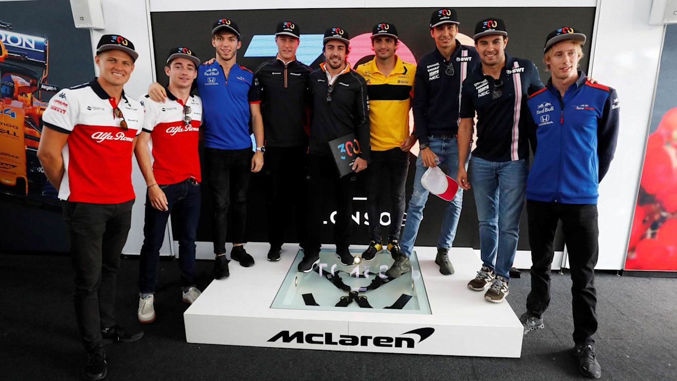 Fernando Alonso (ESP) McLaren celebrates his 300th GP with Marcus Ericsson (SWE) Alfa Romeo Sauber F1 Team, Charles Leclerc (MON) Alfa Romeo Sauber F1 Team, Stoffel Vandoorne (BEL) McLaren, Carlos Sainz jr (ESP) Renault Sport F1 Team, Esteban Ocon (FRA) Force India F1, Sergio Perez (MEX) Force India and Brendon Hartley (NZL) Scuderia Toro Rosso at Formula One World Championship, Rd7, Canadian Grand Prix, Preparations, Montreal, Canada, Thursday 7 June 2018. © Steven Tee/LAT/Sutton Images