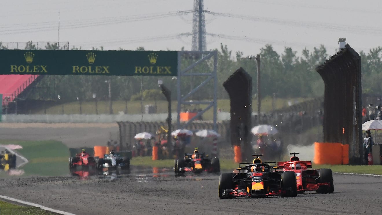 Daniel Ricciardo (AUS) Red Bull Racing RB14 and Sebastian Vettel (GER) Ferrari SF-71H battle at Formula One World Championship, Rd3, Chinese Grand Prix, Race, Shanghai, China, Sunday 15 April 2018. © Rubio/Sutton Images