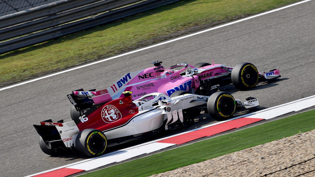 Charles Leclerc (MON) Alfa Romeo Sauber C37 and Sergio Perez (MEX) Force India VJM11 at Formula One World Championship, Rd3, Chinese Grand Prix, Race, Shanghai, China, Sunday 15 April 2018. © Jerry Andre/Sutton Images