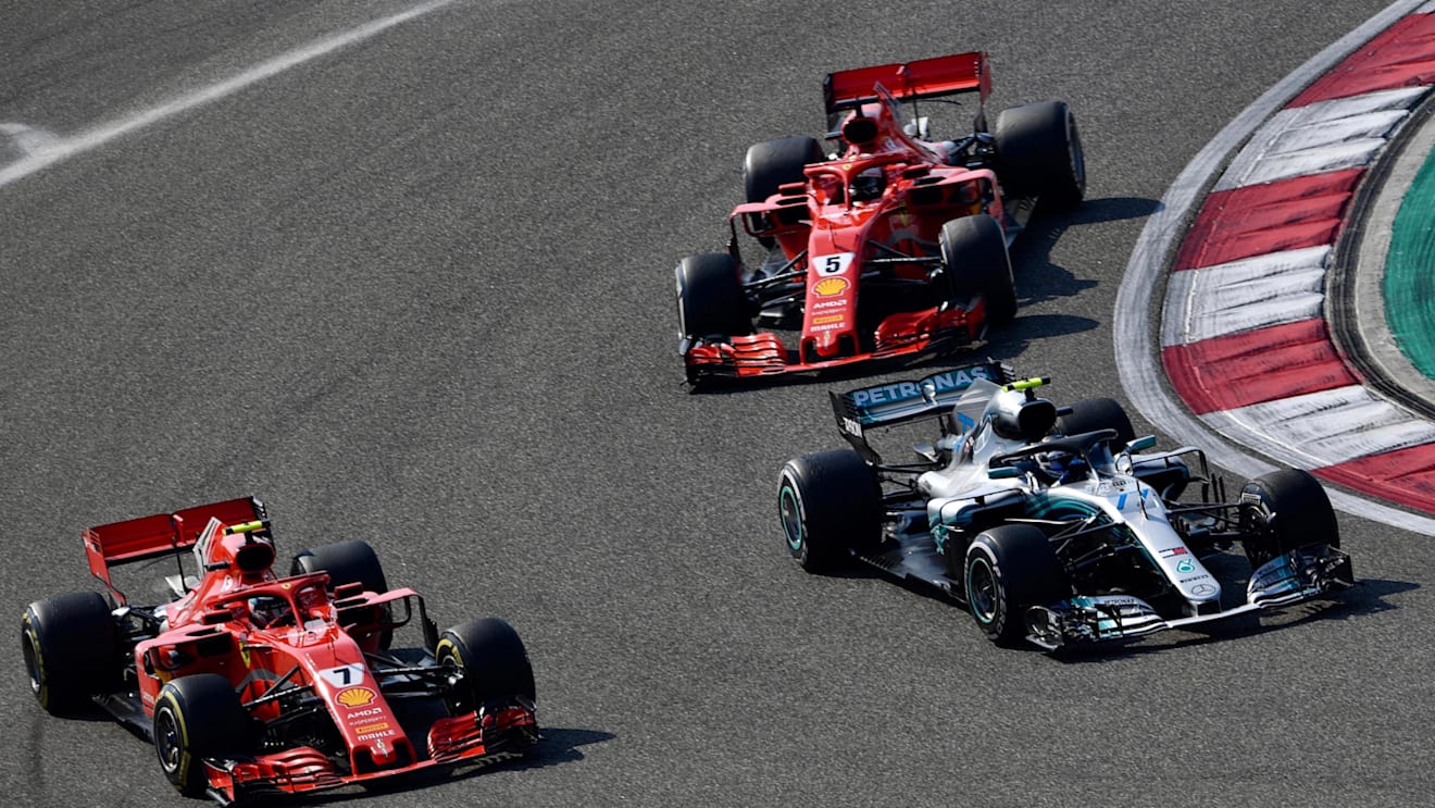 Kimi Raikkonen (FIN) Ferrari SF-71H and Valtteri Bottas (FIN) Mercedes-AMG F1 W09 EQ Power+ battle and Sebastian Vettel (GER) Ferrari SF-71H at Formula One World Championship, Rd3, Chinese Grand Prix, Race, Shanghai, China, Sunday 15 April 2018. © Jerry Andre/Sutton Images