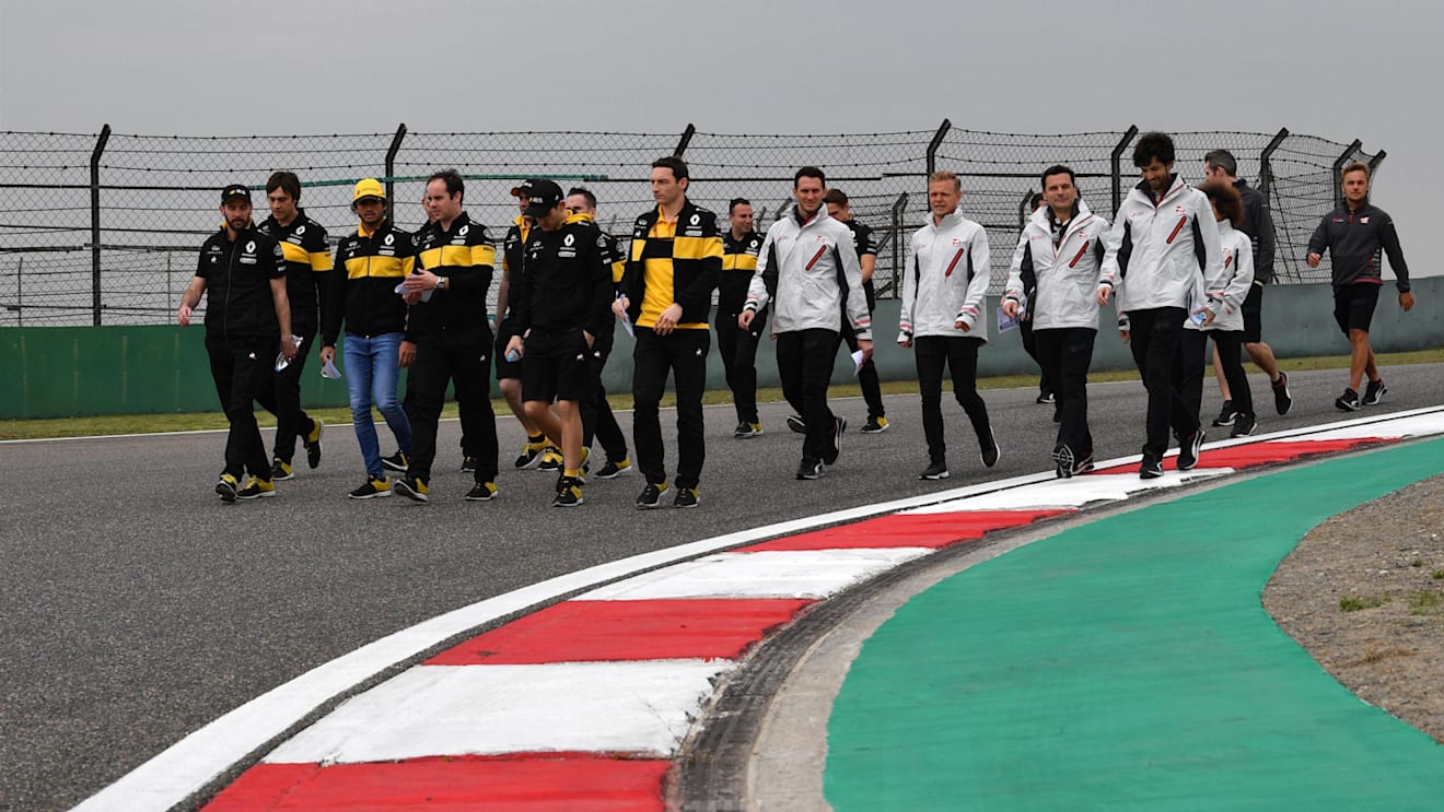Carlos Sainz jr (ESP) Renault Sport F1 Team and Kevin Magnussen (DEN) Haas F1 walk the track at Formula One World Championship, Rd3, Chinese Grand Prix, Preparations, Shanghai, China, Thursday 12 April 2018. © Mark Sutton/Sutton Images