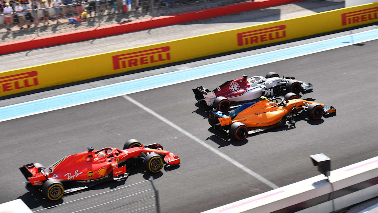 Marcus Ericsson (SWE) Alfa Romeo Sauber C37, Stoffel Vandoorne (BEL) McLaren MCL33 and Sebastian Vettel (GER) Ferrari SF-71H battle at Formula One World Championship, Rd8, French Grand Prix, Race, Paul Ricard, France, Sunday 24 June 2018. © Jerry Andre/Sutton Images