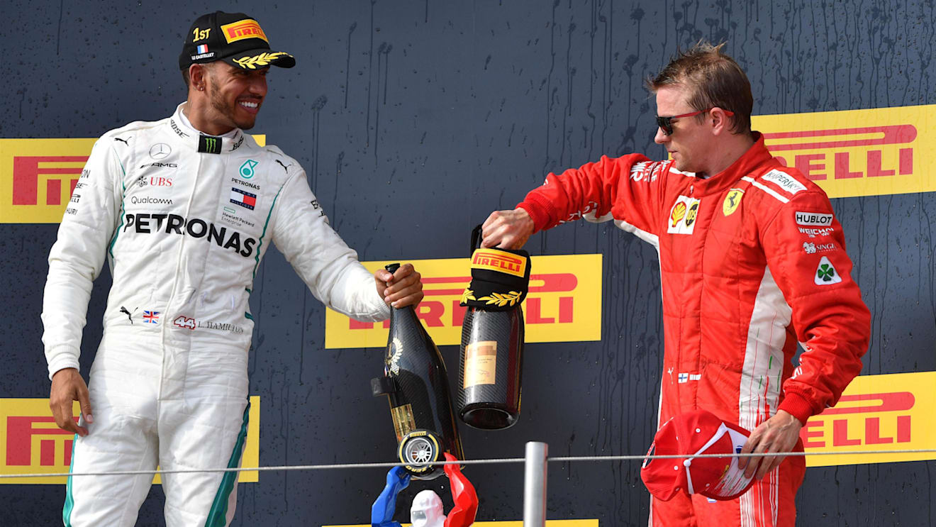 Race winner Lewis Hamilton (GBR) Mercedes-AMG F1 and Kimi Raikkonen (FIN) Ferrari celebrate on the podium with the champagne at Formula One World Championship, Rd8, French Grand Prix, Race, Paul Ricard, France, Sunday 24 June 2018. © Mark Sutton/Sutton Images