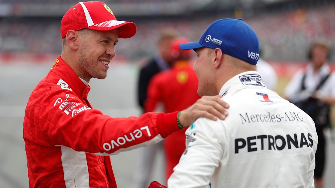Pole sitter Sebastian Vettel (GER) Ferrari celebrates in parc ferme with Valtteri Bottas (FIN) Mercedes-AMG F1 at Formula One World Championship, Rd11, German Grand Prix, Qualifying, Hockenheim, Germany, Saturday 21 July 2018. © Steven Tee/LAT/Sutton Images