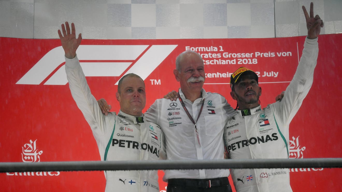 Valtteri Bottas (FIN) Mercedes-AMG F1, Dr. Dieter Zetsche (GER), CEO of Daimler AG and Lewis Hamilton (GBR) Mercedes-AMG F1 celebrate on the podium at Formula One World Championship, Rd11, German Grand Prix, Race, Hockenheim, Germany, Sunday 22 July 2018. © Mark Sutton/Sutton Images