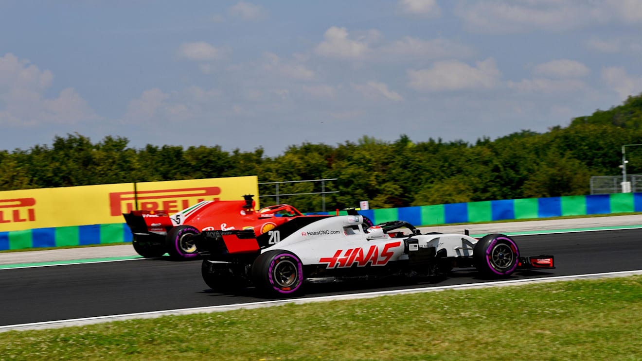 Kevin Magnussen (DEN) Haas VF-18 and Sebastian Vettel (GER) Ferrari SF-71H at Formula One World Championship, Rd12, Hungarian Grand Prix, Practice, Hungaroring, Hungary, Friday 27 July 2018. © Jerry Andre/Sutton Images