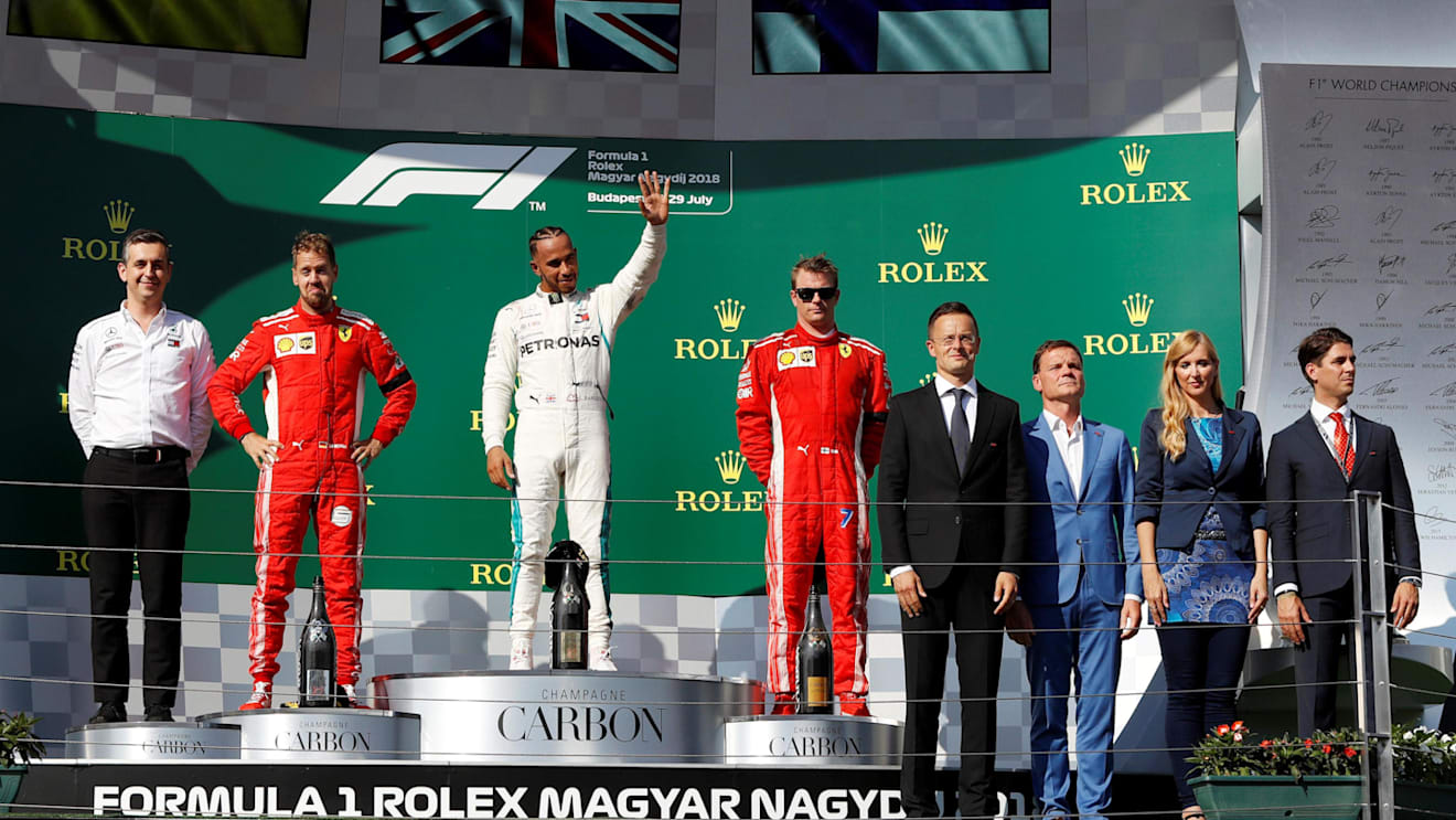 Sebastian Vettel (GER) Ferrari, Lewis Hamilton (GBR) Mercedes-AMG F1 and Kimi Raikkonen (FIN) Ferrari celebrate on the podium at Formula One World Championship, Rd12, Hungarian Grand Prix, Race, Hungaroring, Hungary, Sunday 29 July 2018. © Manuel Goria/Sutton Images