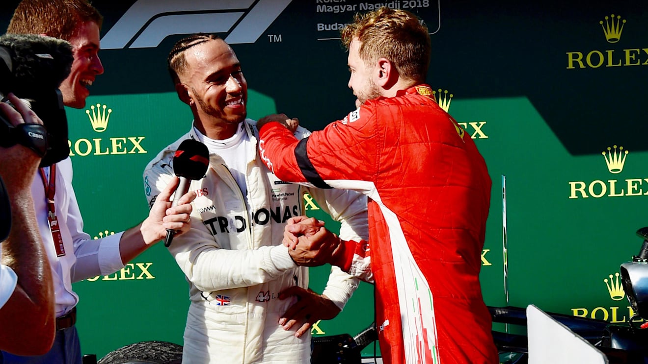 Lewis Hamilton (GBR) Mercedes-AMG F1 and Sebastian Vettel (GER) Ferrari celebrate in parc ferme at Formula One World Championship, Rd12, Hungarian Grand Prix, Race, Hungaroring, Hungary, Sunday 29 July 2018. © Jerry Andre/Sutton Images