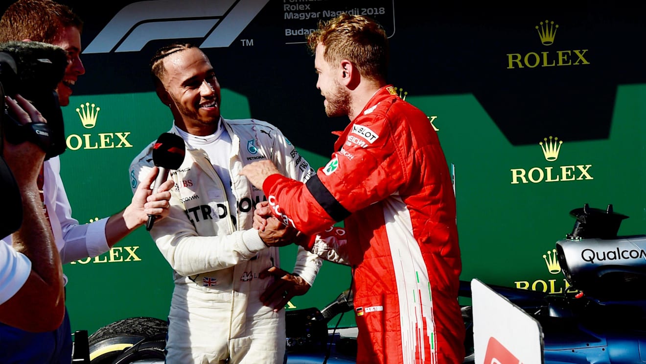 Lewis Hamilton (GBR) Mercedes-AMG F1 and Sebastian Vettel (GER) Ferrari celebrate in parc ferme at Formula One World Championship, Rd12, Hungarian Grand Prix, Race, Hungaroring, Hungary, Sunday 29 July 2018. © Jerry Andre/Sutton Images