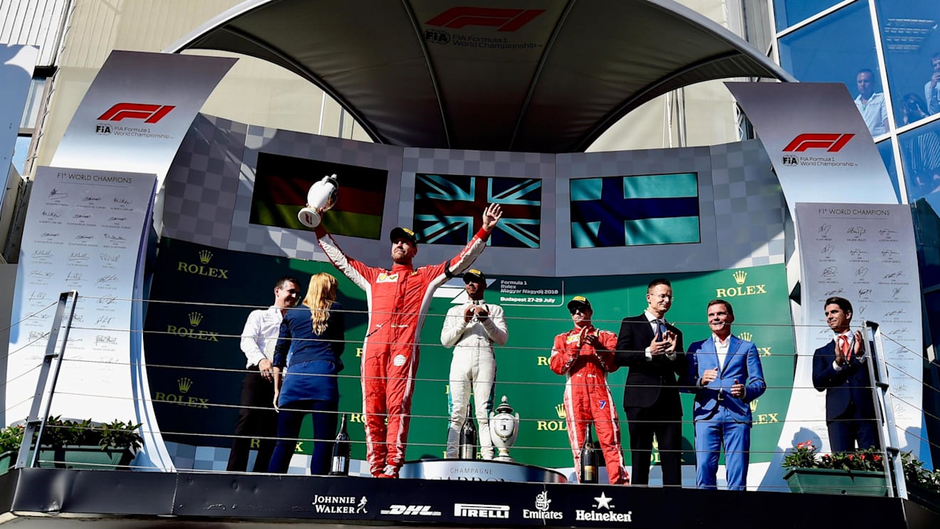 Sebastian Vettel (GER) Ferrari, Lewis Hamilton (GBR) Mercedes-AMG F1 and Kimi Raikkonen (FIN) Ferrari Celebrate On the podium at Formula One World Championship, Rd12, Hungarian Grand Prix, Race, Hungaroring, Hungary, Sunday 29 July 2018. © Jerry Andre/Sutton Images