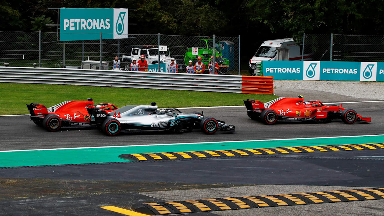 Kimi Raikkonen, Ferrari SF71H, Sebastian Vettel, Ferrari SF71H and Lewis Hamilton, Mercedes AMG F1 W09 battle on lap one at Formula One World Championship, Rd14, Italian Grand Prix, Race, Monza, Italy, Sunday 2 September 2018. © Manuel Goria/Sutton Images