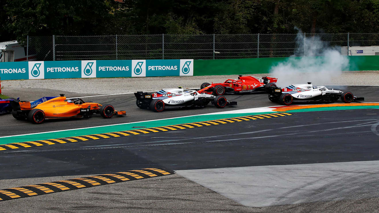Sebastian Vettel, Ferrari SF71H spins after contact with Lewis Hamilton, Mercedes AMG F1 W09 on lap one at Formula One World Championship, Rd14, Italian Grand Prix, Race, Monza, Italy, Sunday 2 September 2018. © Manuel Goria/Sutton Images