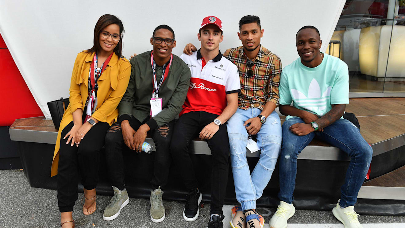 Charles Leclerc, Alfa Romeo Sauber F1 Team with South African Athletes Ruswahl Samaai, Wayde van Niekerk and Akani Simbine at Formula One World Championship, Rd14, Italian Grand Prix, Race, Monza, Italy, Sunday 2 September 2018. © Mark Sutton/Sutton Images