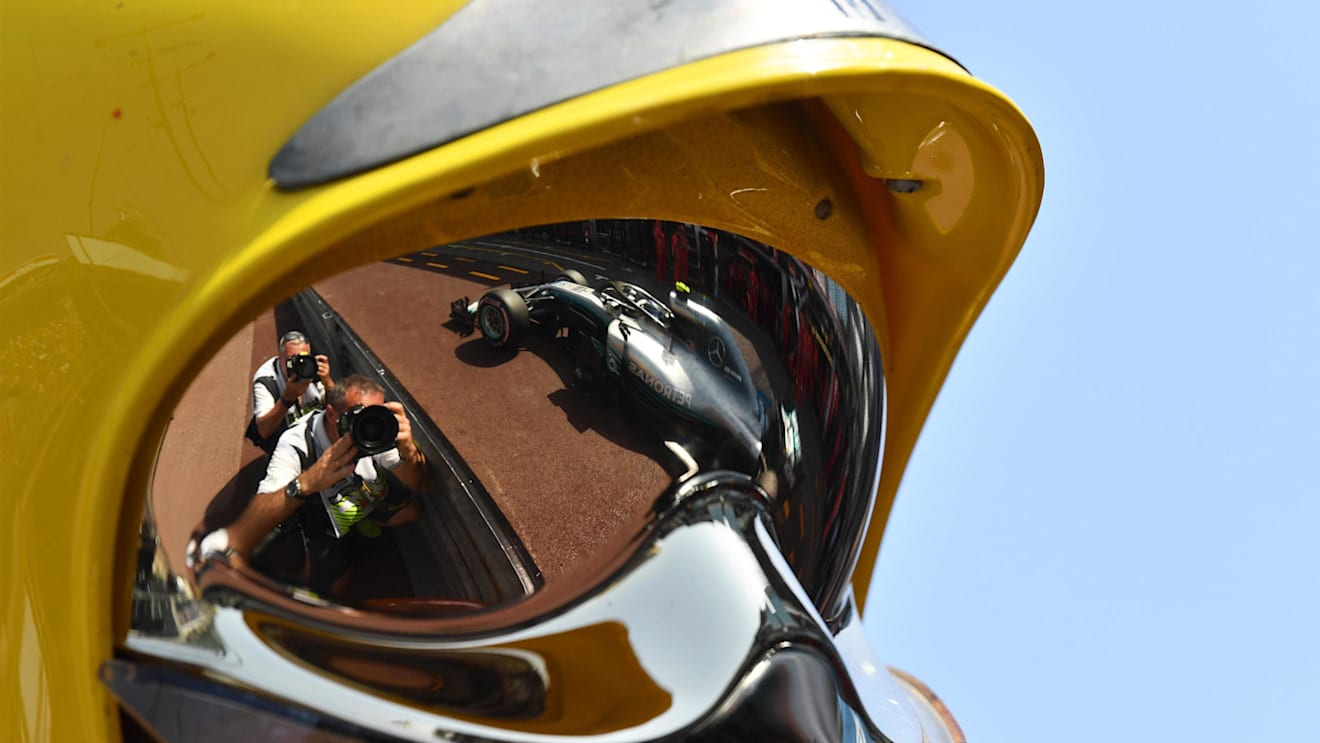 Valtteri Bottas (FIN) Mercedes-AMG F1 W09 EQ Power+ reflected in a firemans helmet at Formula One World Championship, Rd6, Monaco Grand Prix, Qualifying, Monte-Carlo, Monaco, Saturday 26 May 2018. © Mark Sutton/Sutton Images