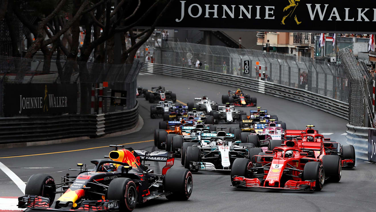 Daniel Ricciardo (AUS) Red Bull Racing RB14 leads Sebastian Vettel (GER) Ferrari SF-71H at the start of the race at Formula One World Championship, Rd6, Monaco Grand Prix, Race, Monte-Carlo, Monaco, Sunday 27 May 2018. © Glenn Dunbar/LAT/Sutton Images