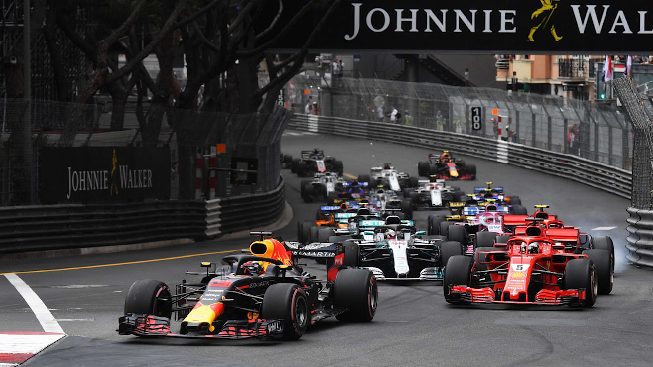 Daniel Ricciardo (AUS) Red Bull Racing RB14 leads Sebastian Vettel (GER) Ferrari SF-71H at the start of the race at Formula One World Championship, Rd6, Monaco Grand Prix, Race, Monte-Carlo, Monaco, Sunday 27 May 2018. © Mark Sutton/Sutton Images