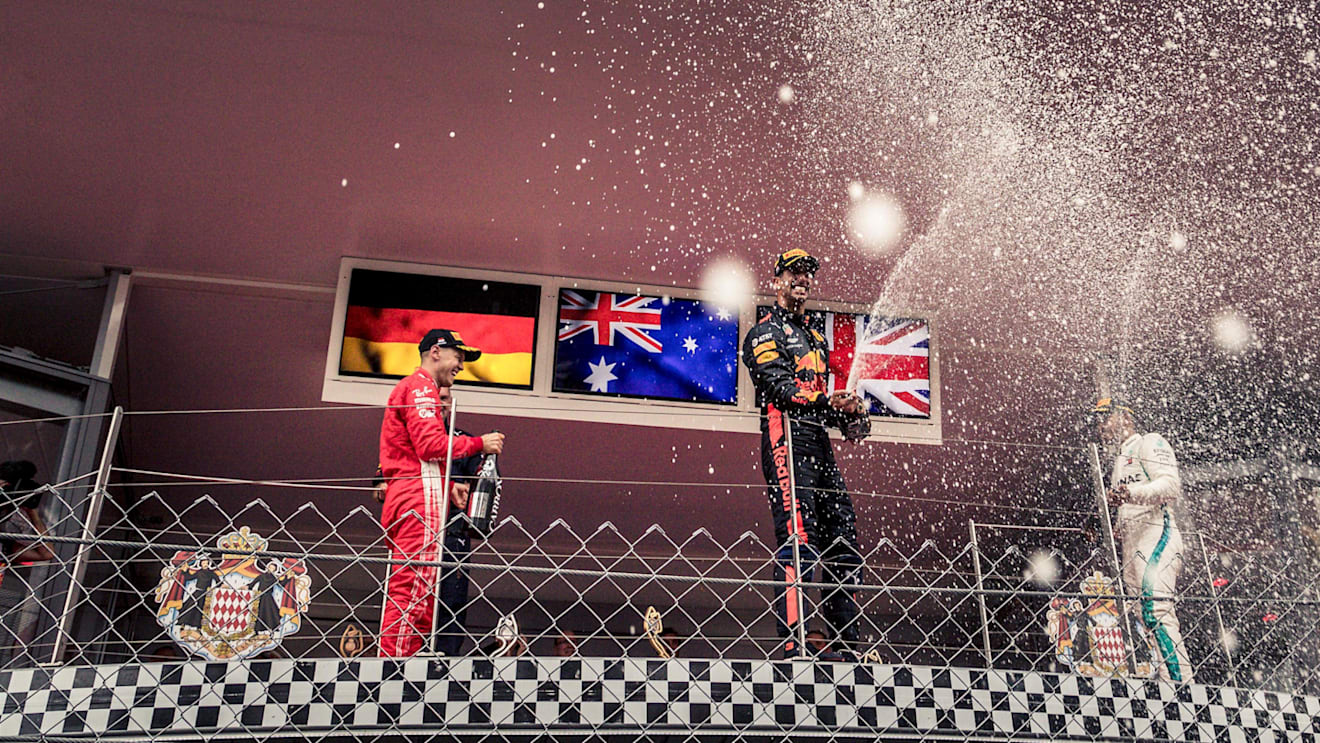 Sebastian Vettel (GER) Ferrari, Daniel Ricciardo (AUS) Red Bull Racing and Lewis Hamilton (GBR) Mercedes-AMG F1 celebrate on the podium with the champagne at Formula One World Championship, Rd6, Monaco Grand Prix, Race, Monte-Carlo, Monaco, Sunday 27 May