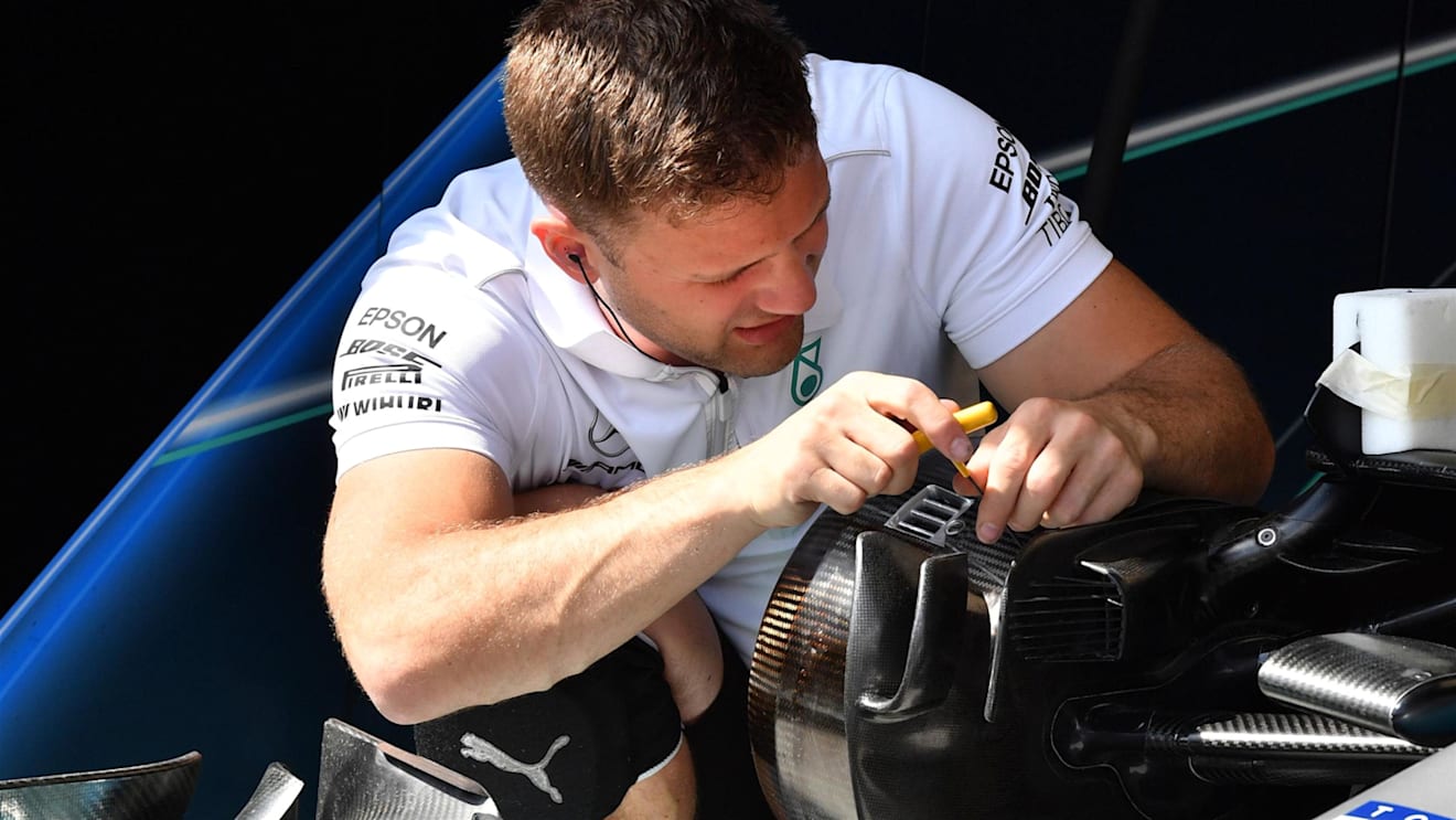 Mercedes AMG F1 mechanic works on Mercedes-AMG F1 W09 EQ Power+ front wheel hub at Formula One World Championship, Rd6, Monaco Grand Prix, Practice, Monte-Carlo, Monaco, Thursday 24 May 2018. © Mark Sutton/Sutton Images
